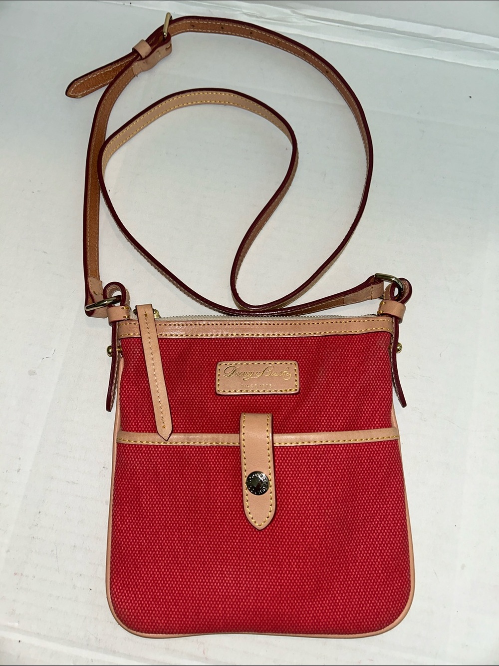 Dooney & Bourke red canvas & leather  letter carrier crossbody bag